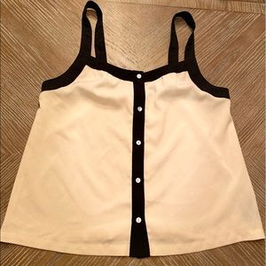 Xxi cream spaghetti strap blouse with black trim.